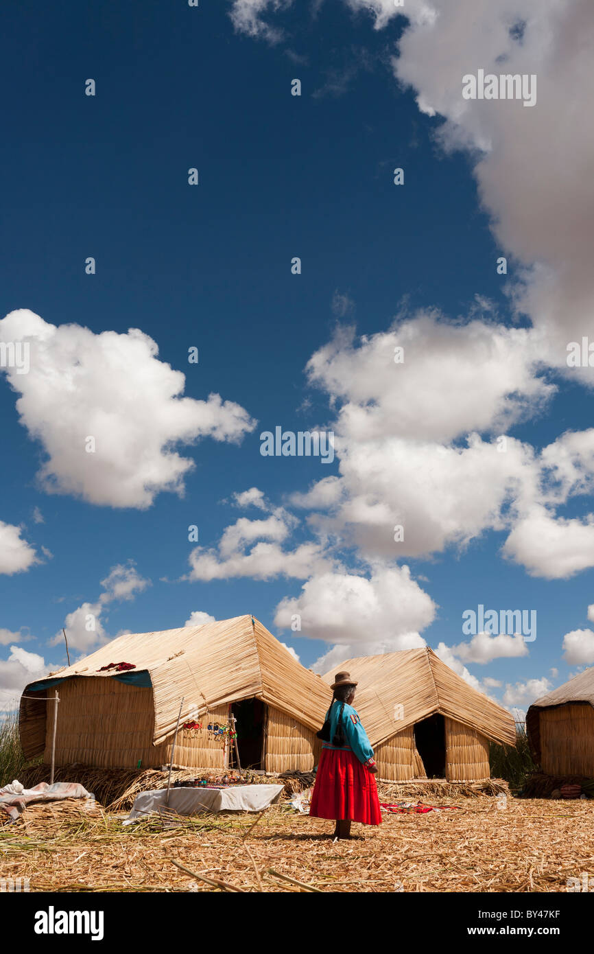 Traditional reed house on the floating islands of Uros on Lake Titicaca ...