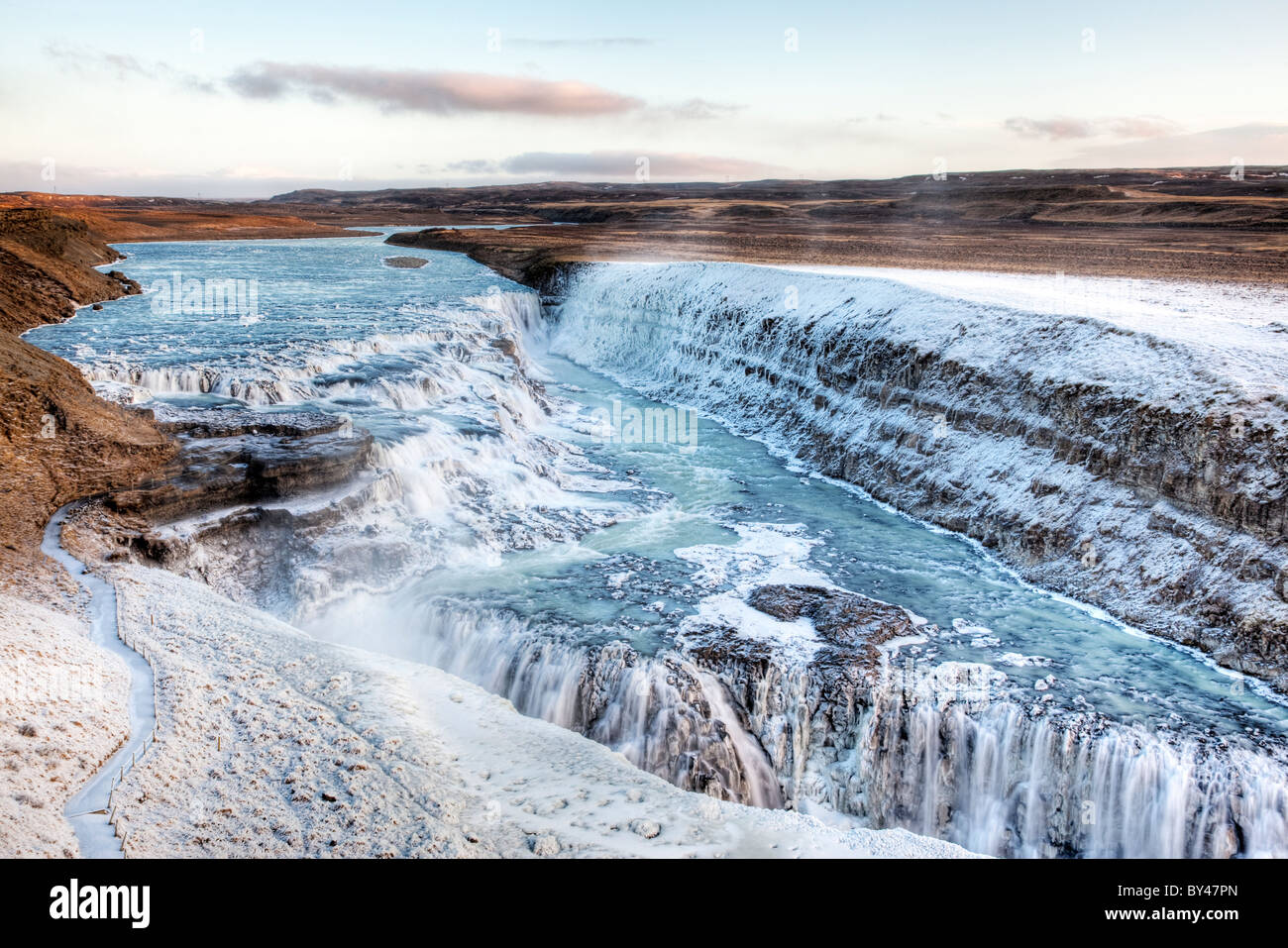 The Gulfoss waterfall in Iceland. Partially frozen, with frost attached to the surroundings. Stock Photo