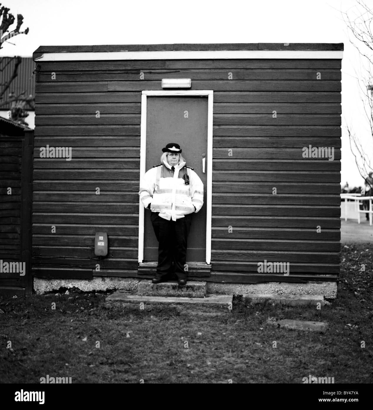 A guard guarding a shed at the Fontwell Races. England Stock Photo