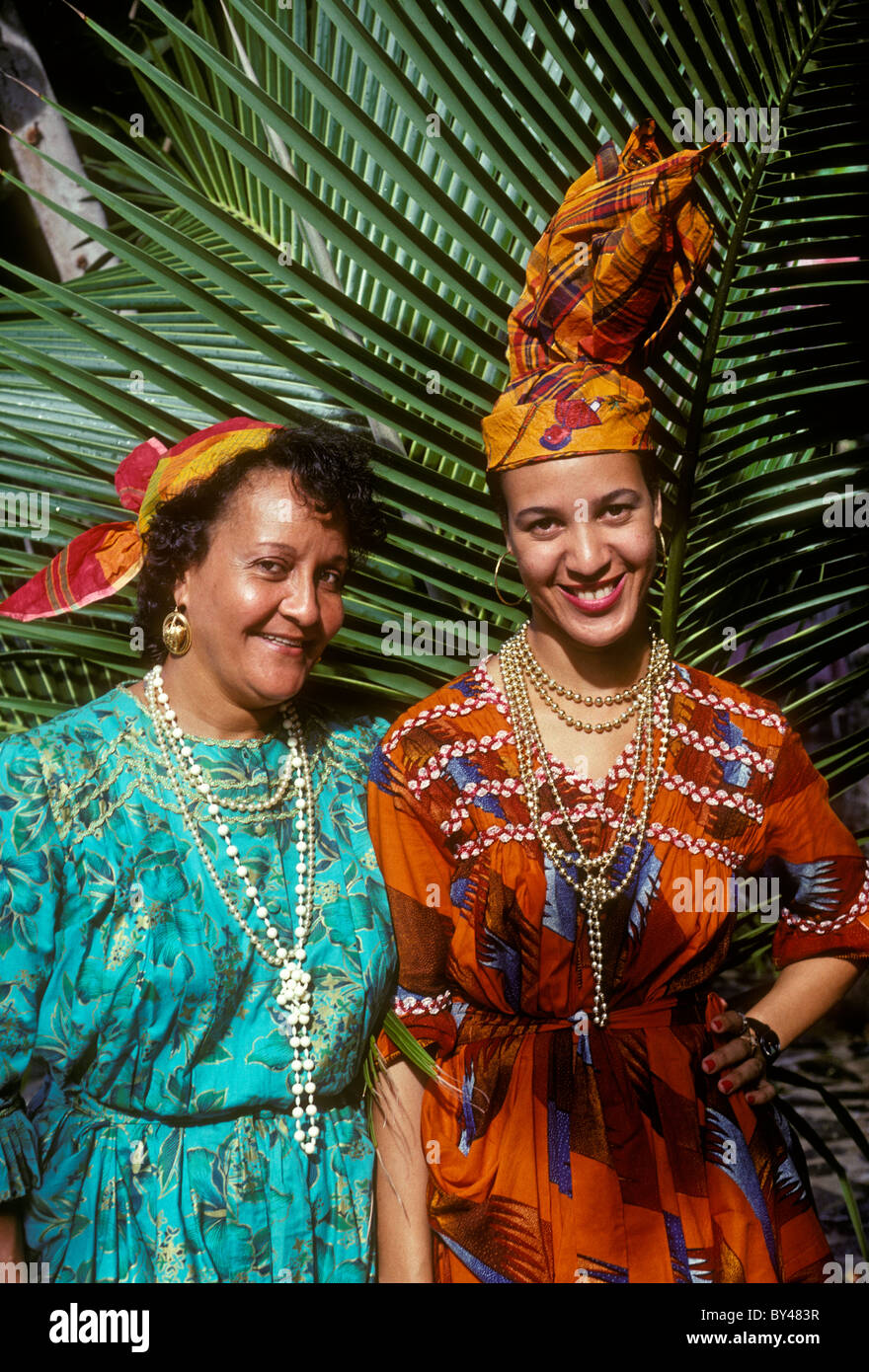 2, two, women, traditional costume, front view, La Plage de Grande Anse, town of Deshaies, Basse-Terre Island, Guadeloupe, French West Indies, France Stock Photo