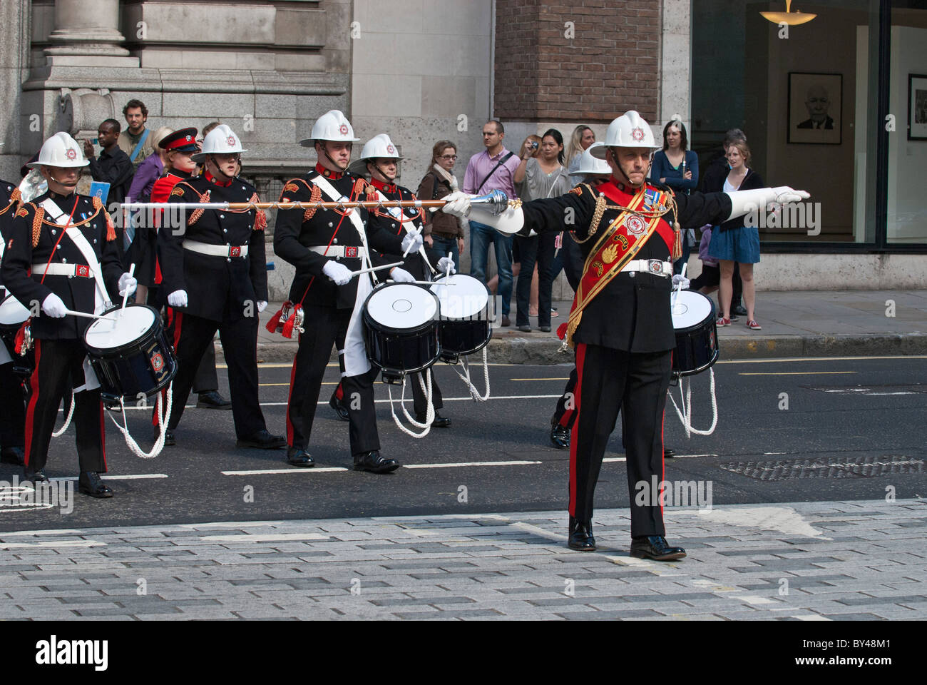 March master leads Fire brigade band National firefighters memorial Service of remembrance crossing Newgate Street EC1 London . Stock Photo