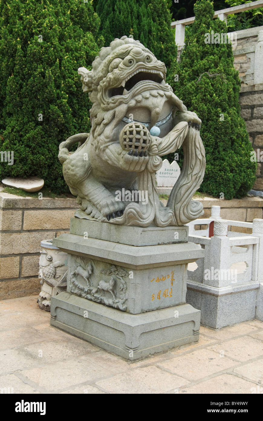 Stone carving Singha as the guardian of the shrine, Meizhou Island, Fujian Stock Photo