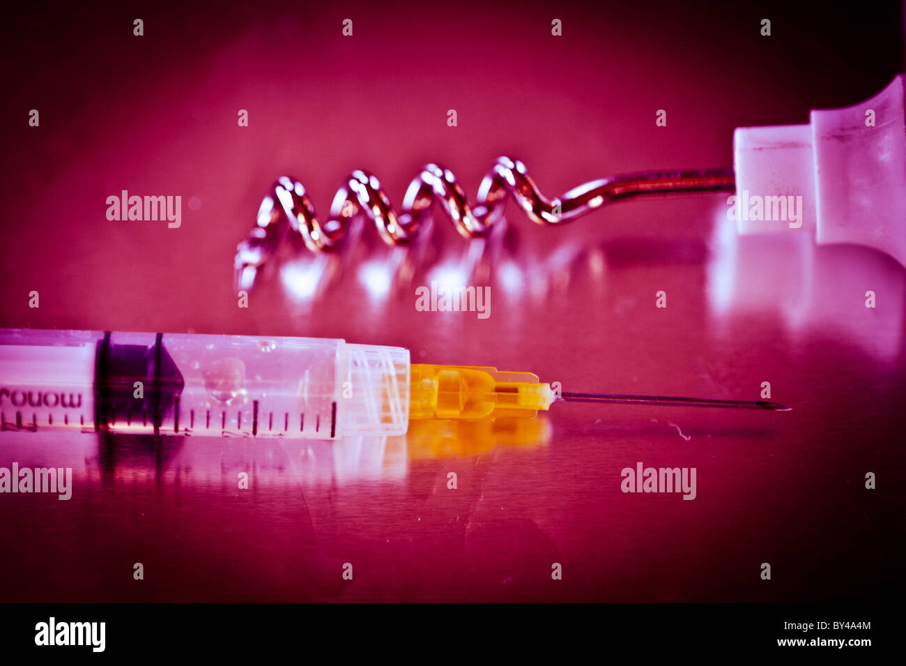 Syringe and corkscrew Stock Photo