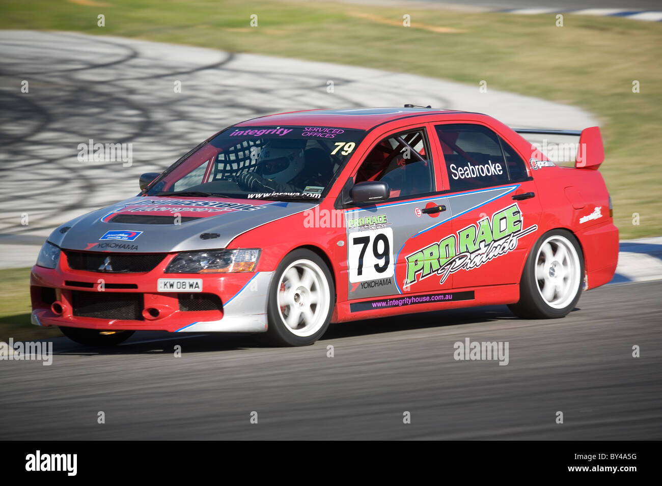 Australian club level motorsport competitor, Gary Seabrooke, powers his IPRA spec' Mitsubishi EVO Lancer around a corner. Stock Photo