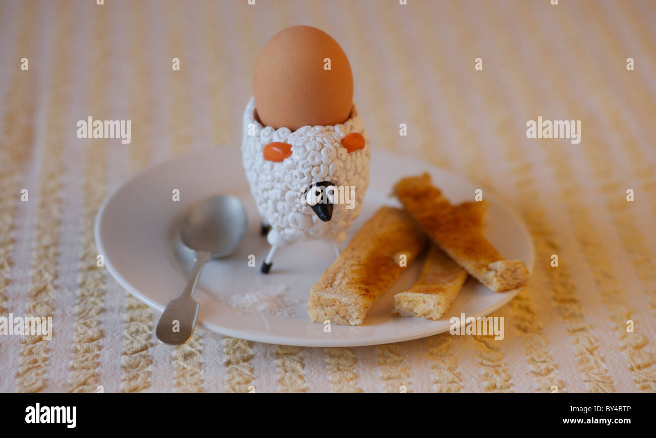 https://c8.alamy.com/comp/BY4BTP/childrens-sheep-egg-cup-with-boiled-egg-and-buttered-soldiers-BY4BTP.jpg