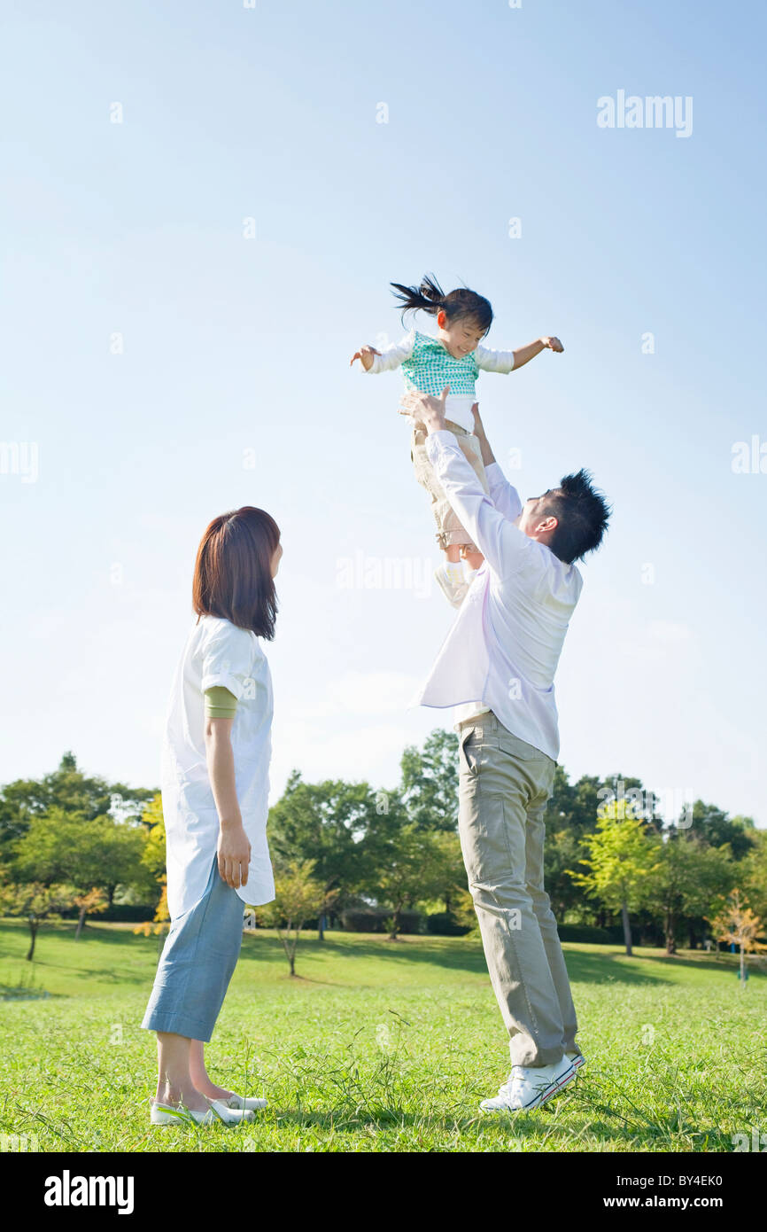 Father lifting up daughter Stock Photo