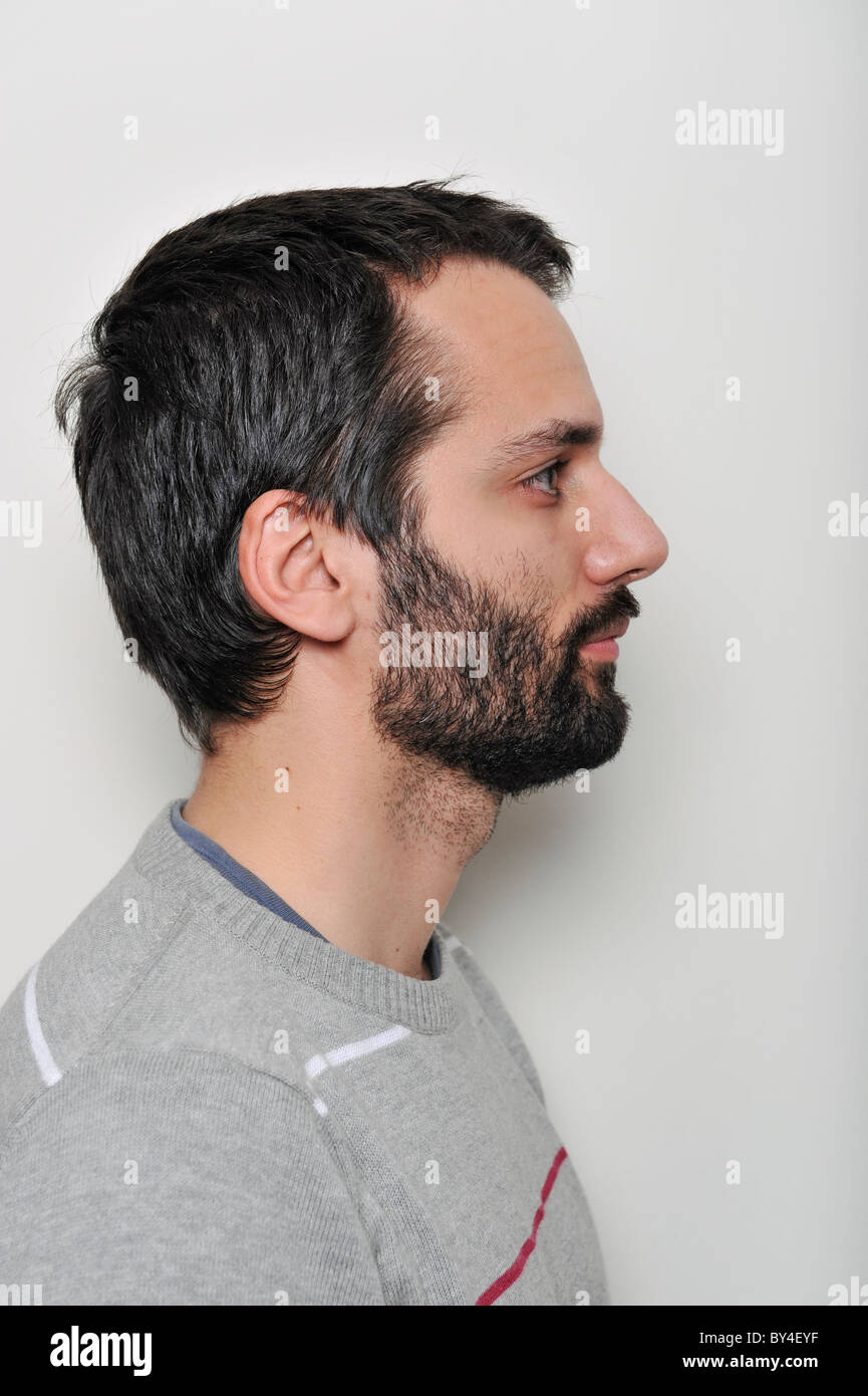Profile portrait of a bearded young man Stock Photo