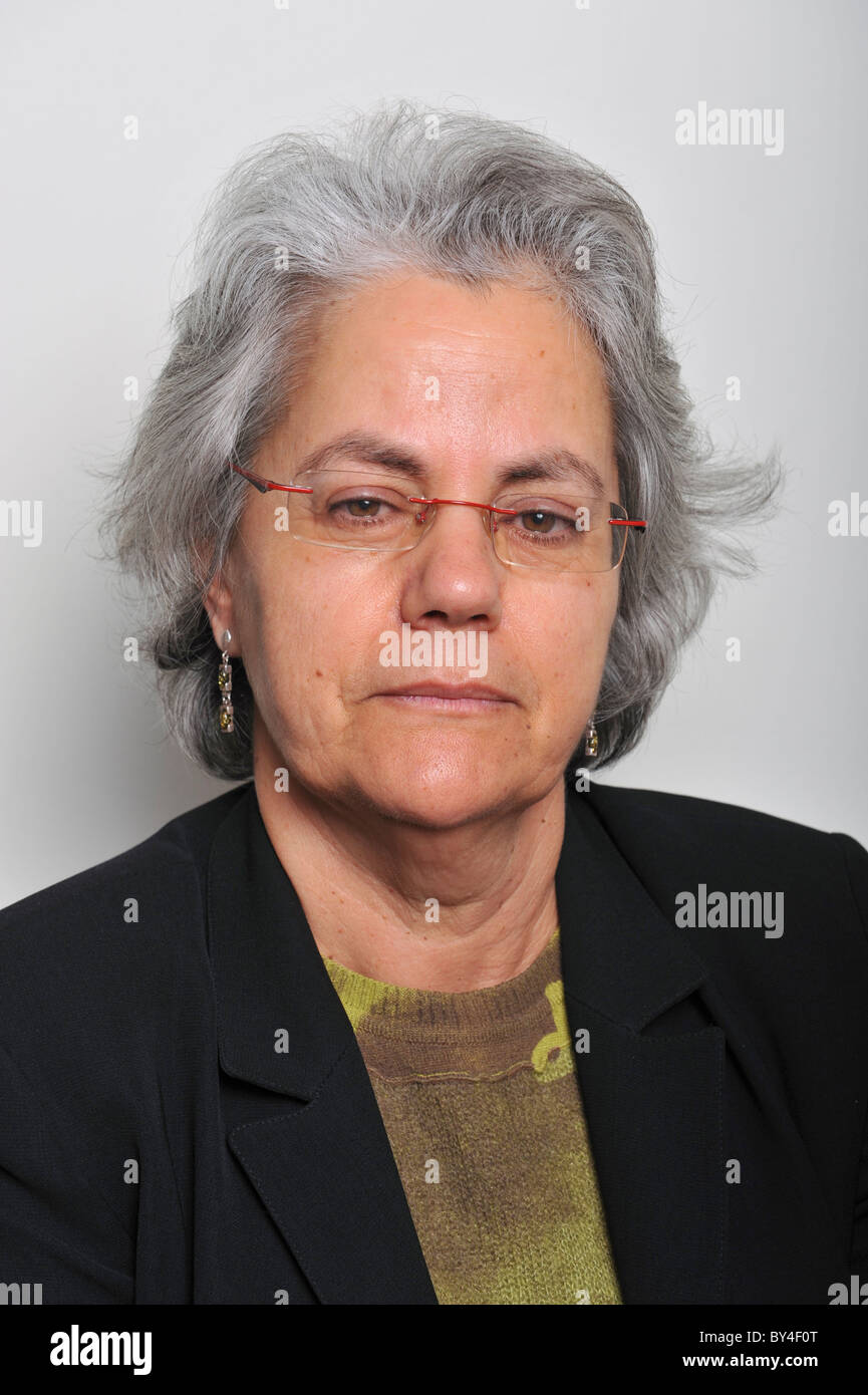 Portrait of a middle aged woman with glasses looking at camera Stock Photo