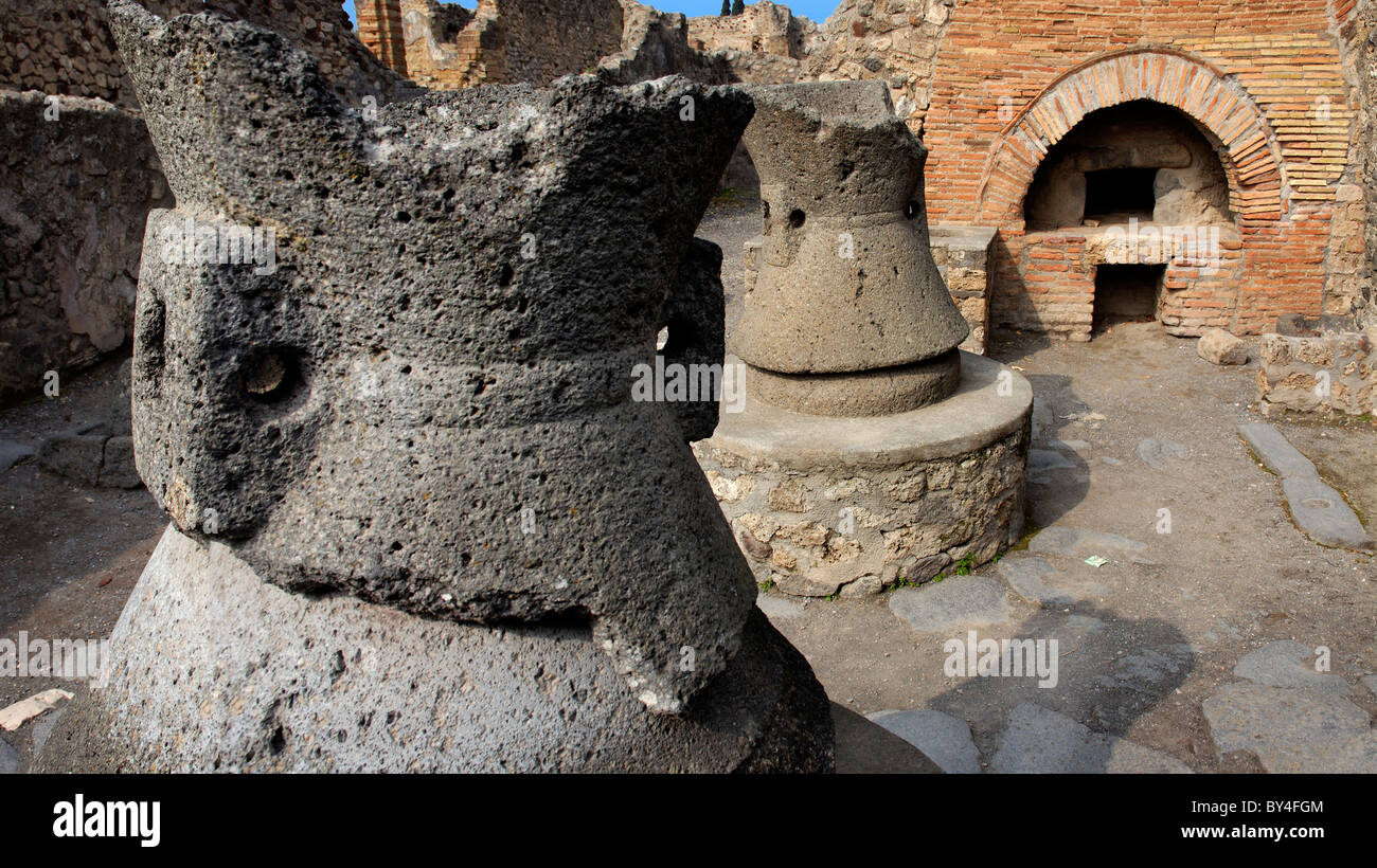 Millstones and ovens in one of the bakeries at Pompeii, near Naples, Italy Stock Photo