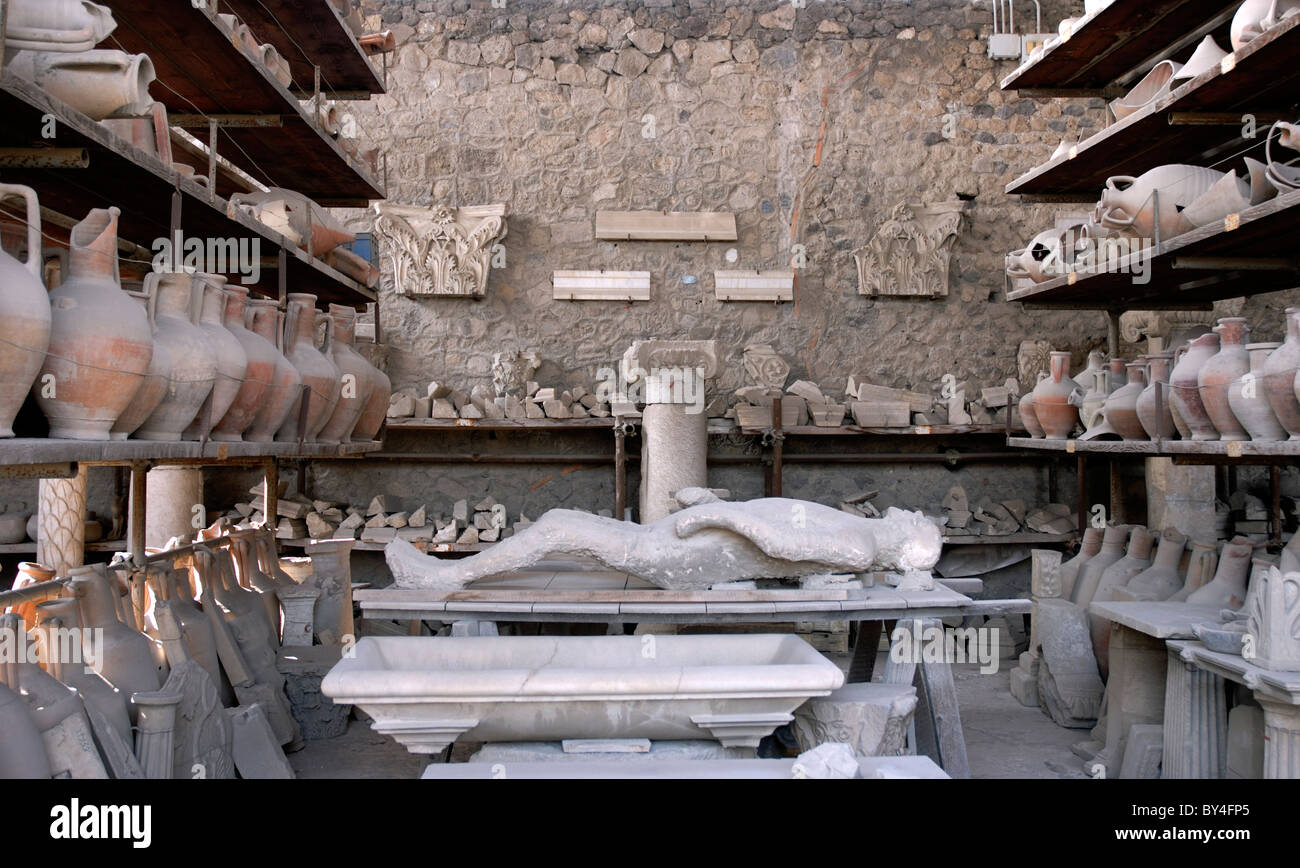 Plaster cast of body and amphora at Pompeii, near Naples, Italy Stock Photo