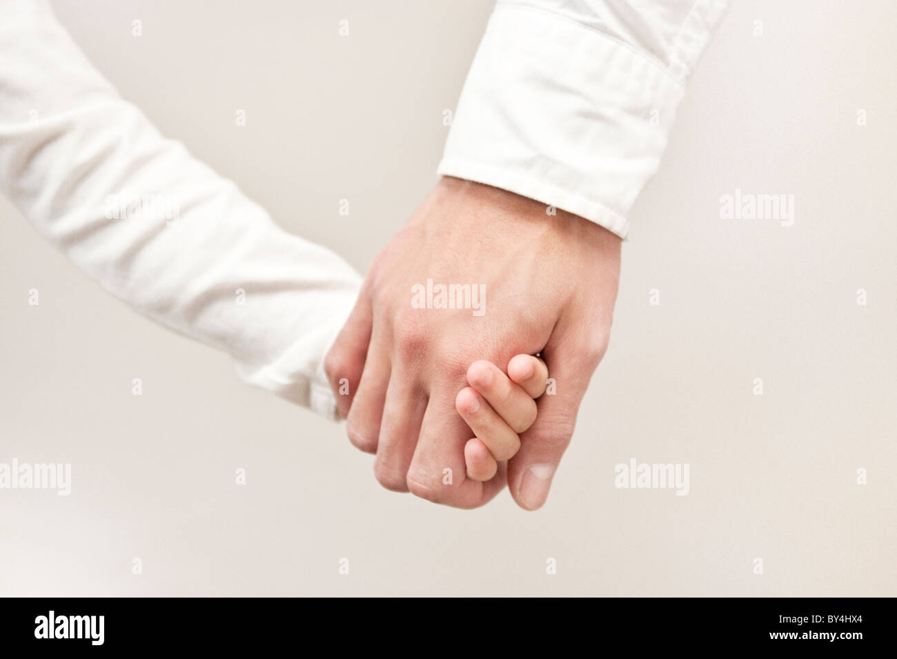 Father and daughter holding hands Stock Photo - Alamy