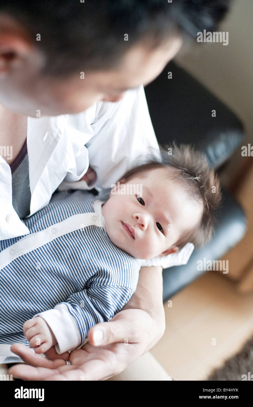Father carrying a baby boy Stock Photo Alamy