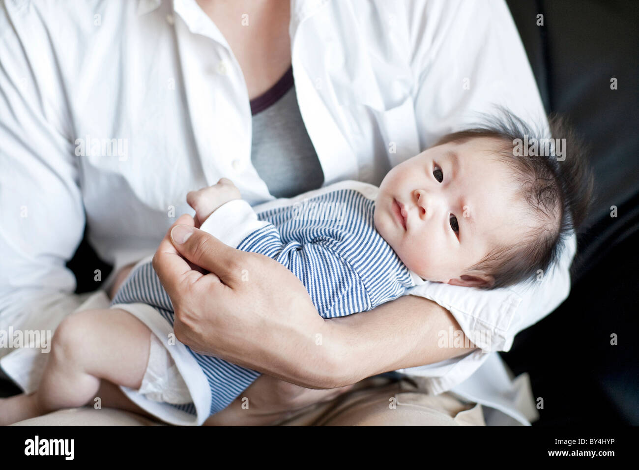 Father carrying a baby boy Stock Photo Alamy