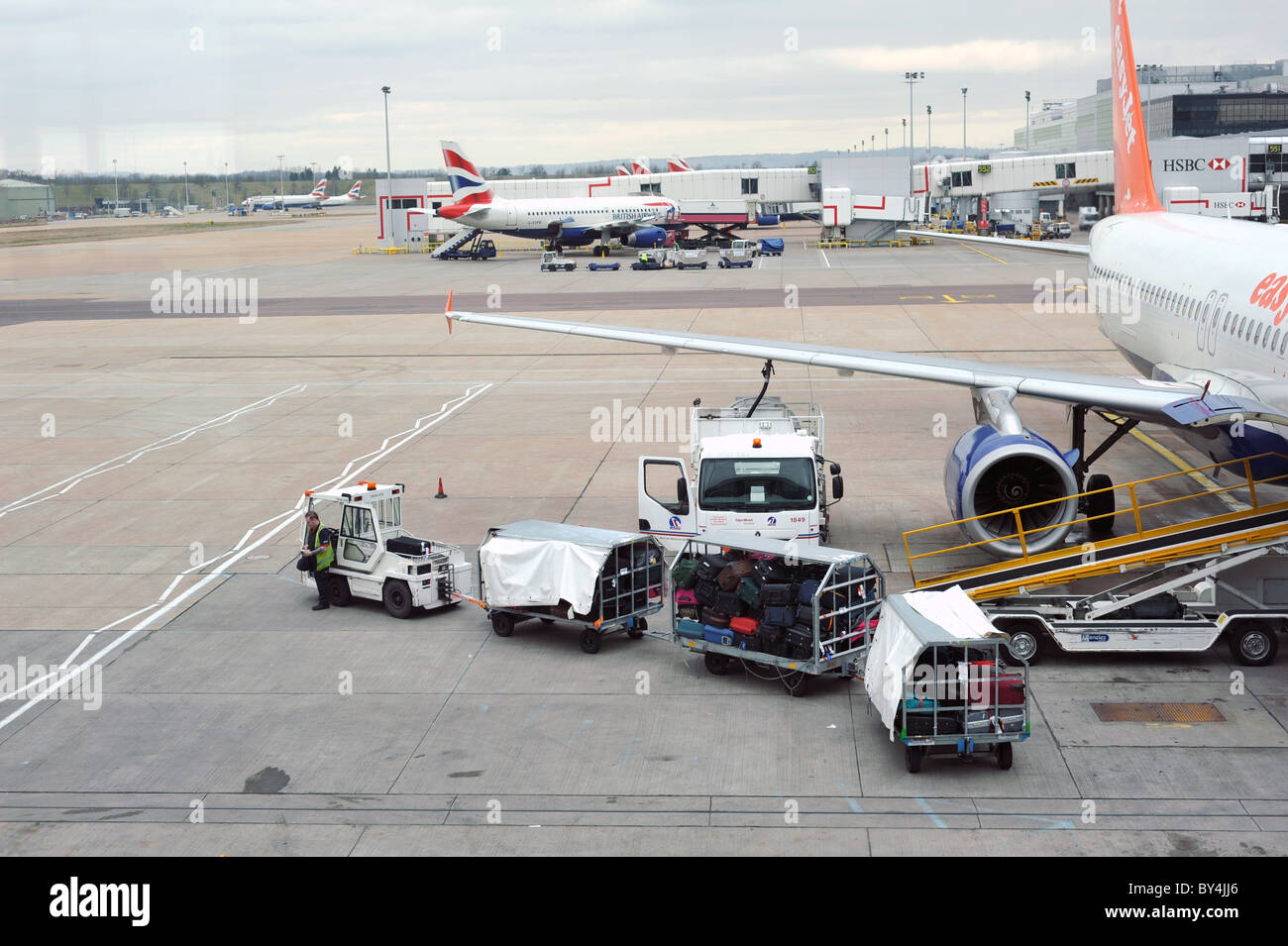 Airside baggage handling at Gatwick airport, UK Stock Photo Alamy