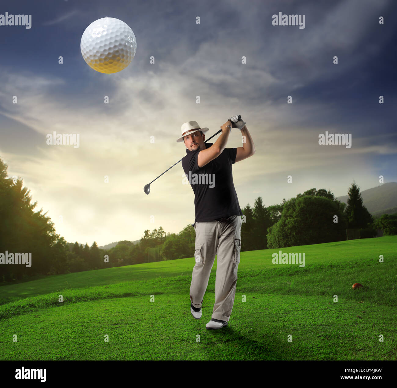 Golf player making a nice launch Stock Photo