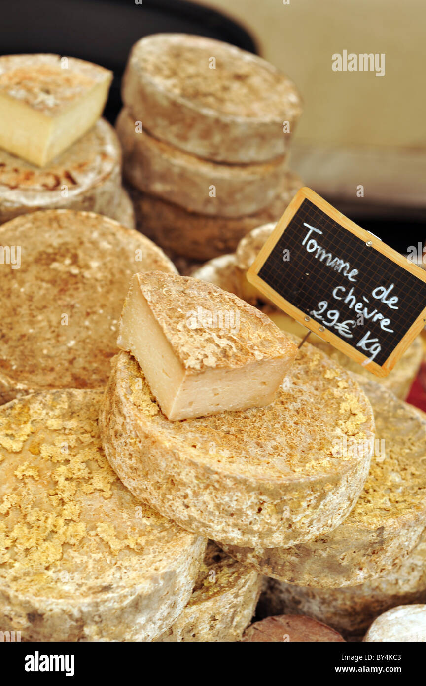Tomme de Chevre cheese for sale at a French street market Stock Photo