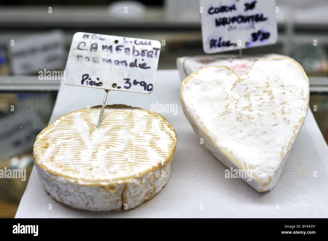 Normandy Camembert and Couer de Neufchatel cheeses for sale at a French