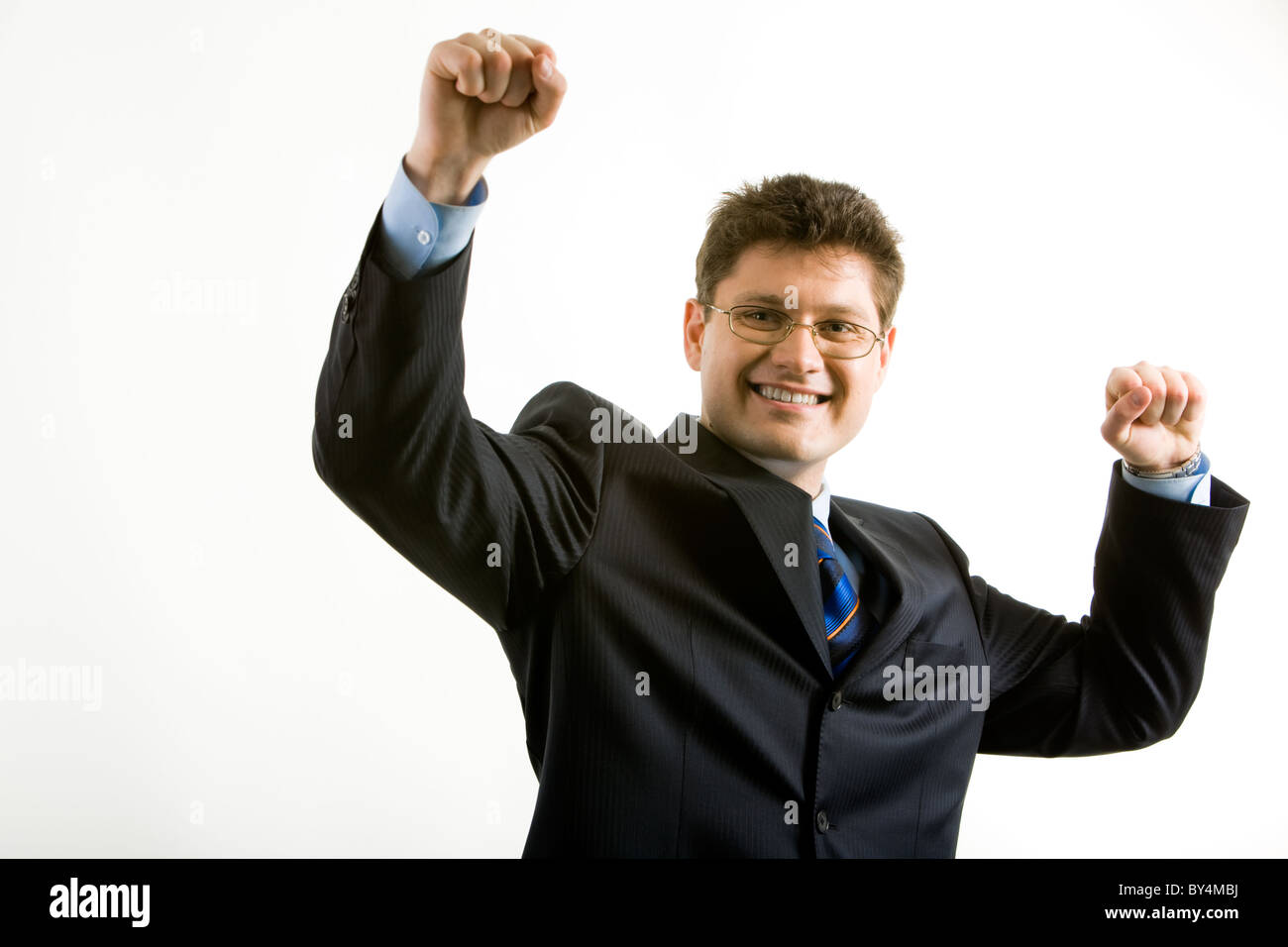 Portrait of happy businessman in suit raising his hands Stock Photo - Alamy