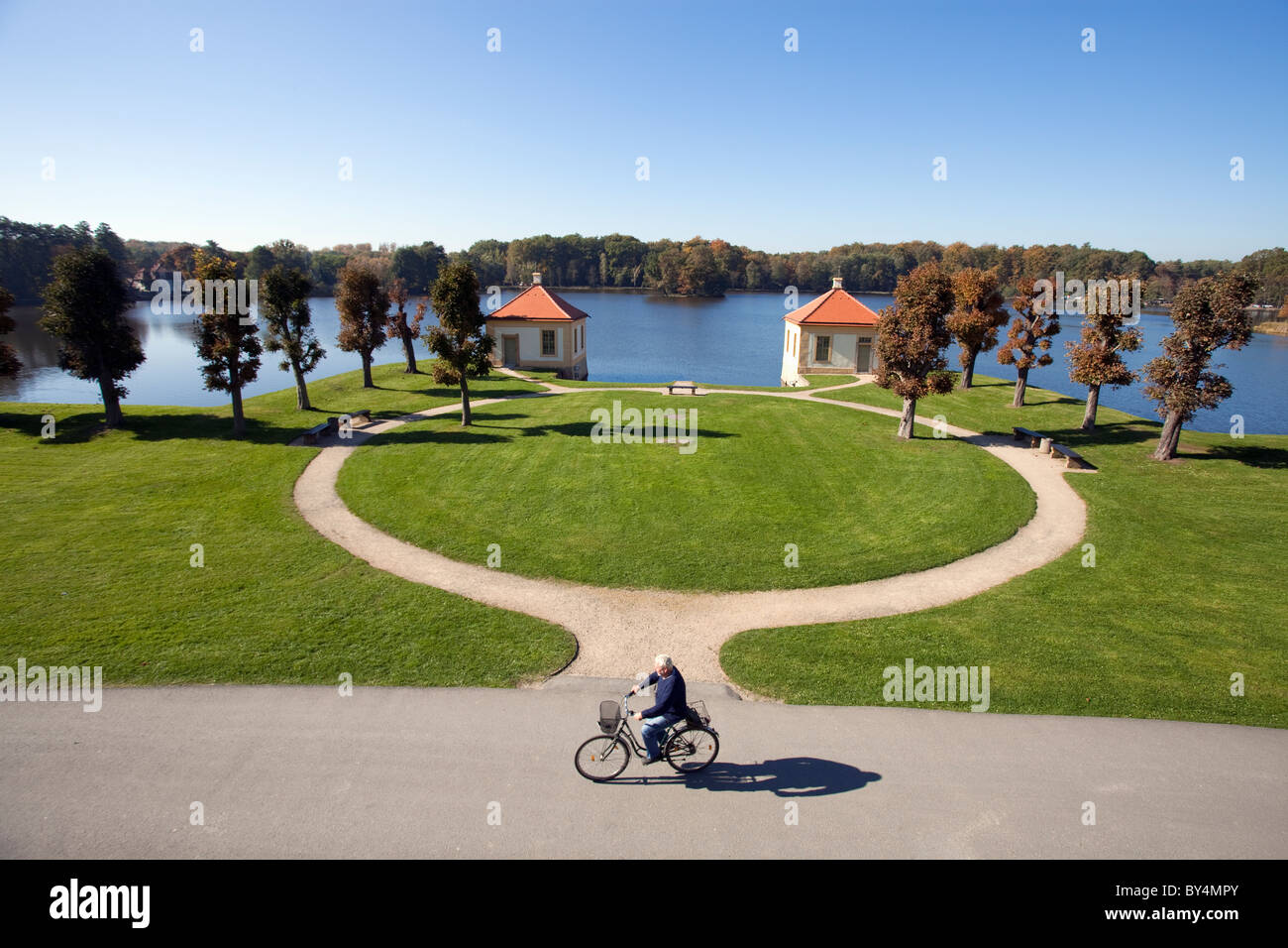 Germany,Saxony,Moritzburg, Moritzburg Castle, cyclist and gardens Stock Photo