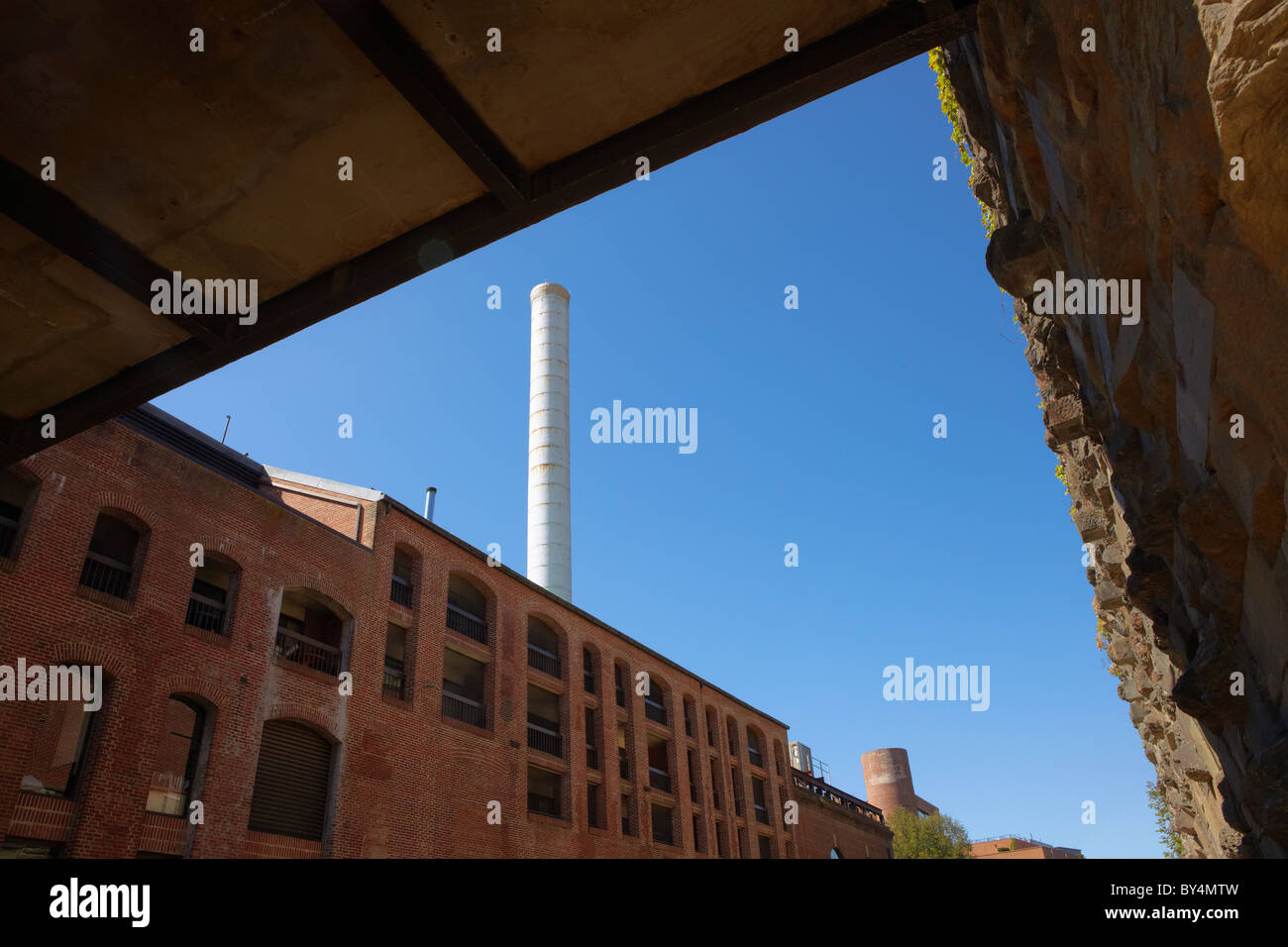 The historic white smokestack of The Powerhouse building as seen from the C&O Canal, Georgetown, Washington, DC. Stock Photo