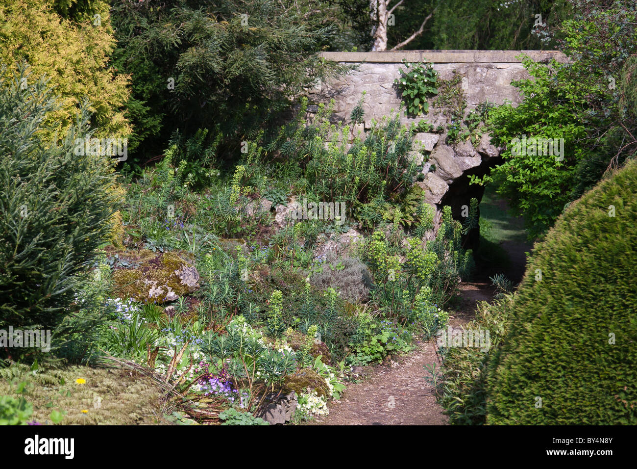 Garden rockery and bridge Stock Photo - Alamy