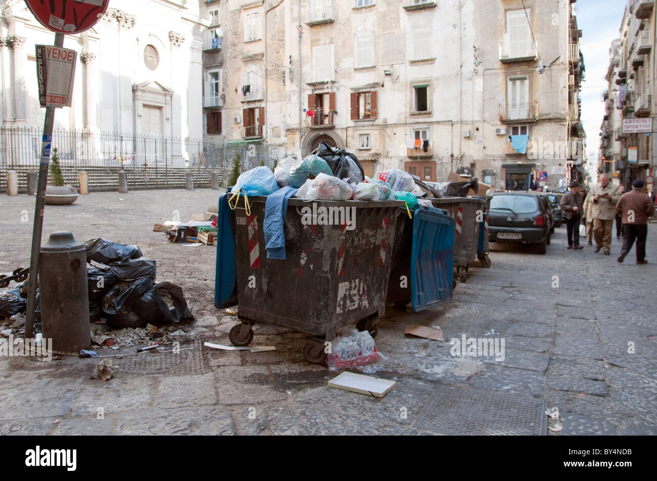Overflowing rubbish bins in the tourist historic quarter of Naples Stock Photo