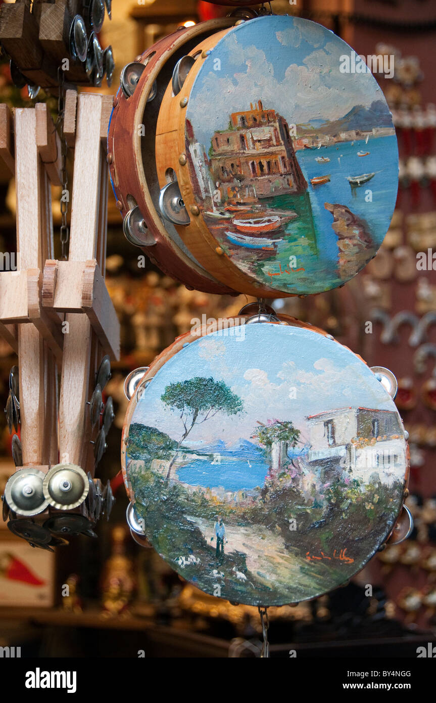 Tambourines with typical Neapolitan scenes on sale in the Spaccanapoli (street) area of Naples Stock Photo