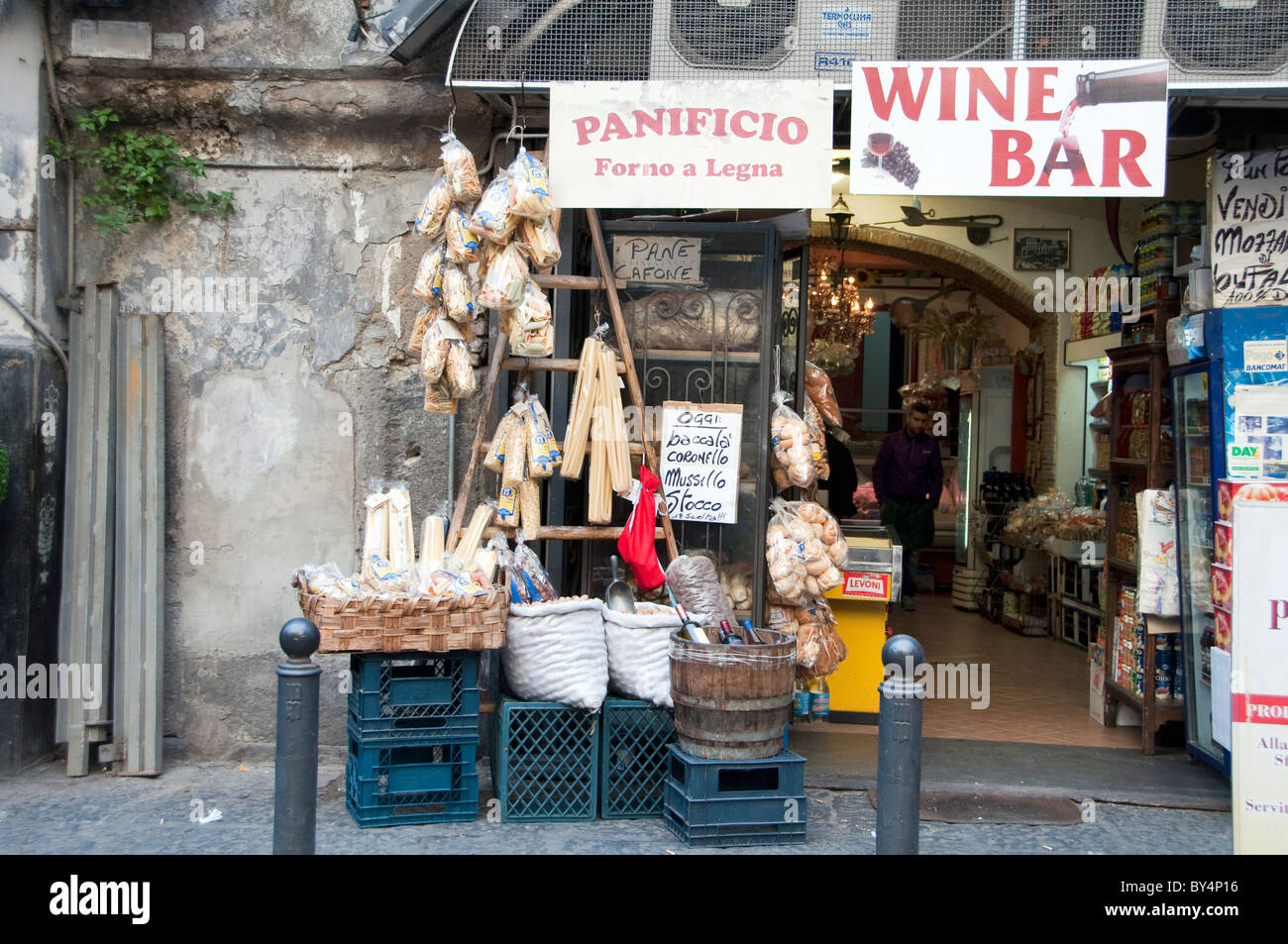 Alimentari or food shop and wine bar in the Spaccanapoli street of Naples, Italy Stock Photo