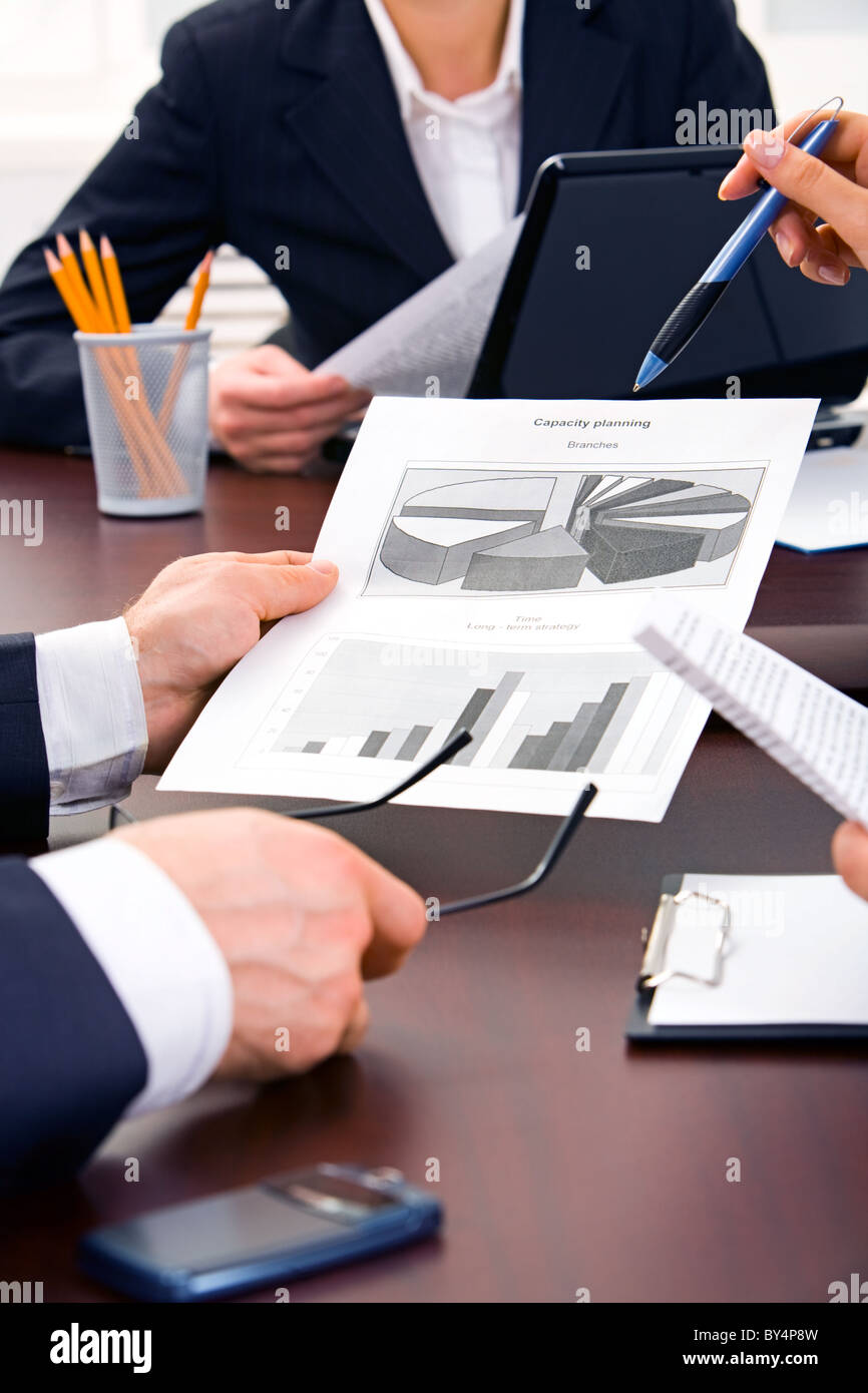 Vertical image of people’s hands during discussion at business meeting Stock Photo Alamy