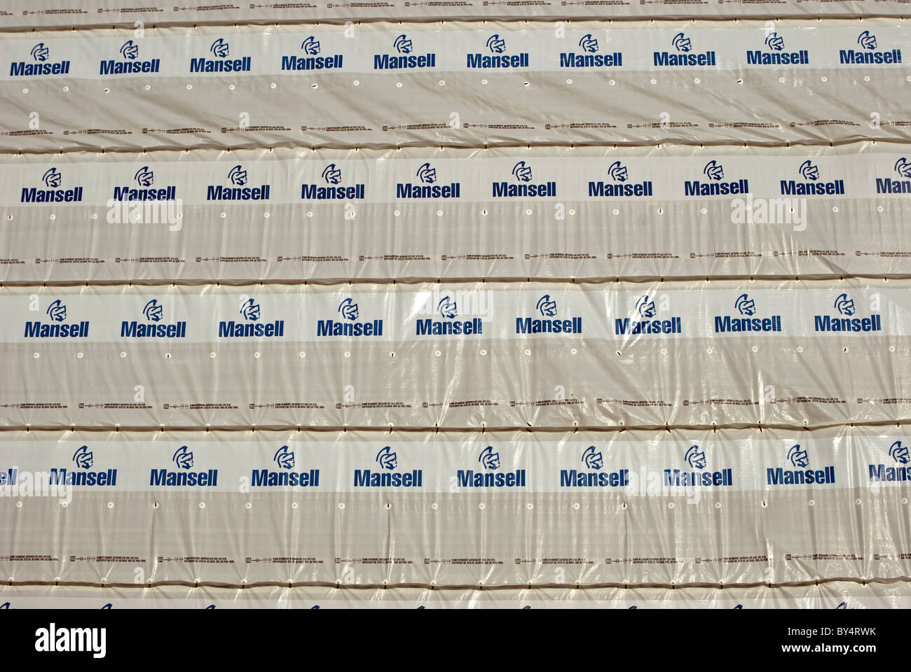 flame retardant sheets on a building with logo of the british construction company, mansell Stock Photo