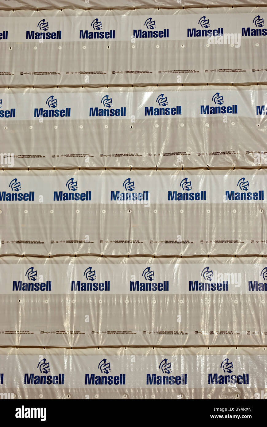 flame retardant sheets on a building with logo of the british construction company, mansell Stock Photo
