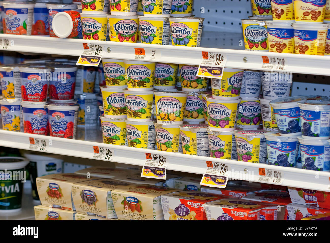 Yogurt for sale on shelves in grocery store cooler Stock Photo Alamy