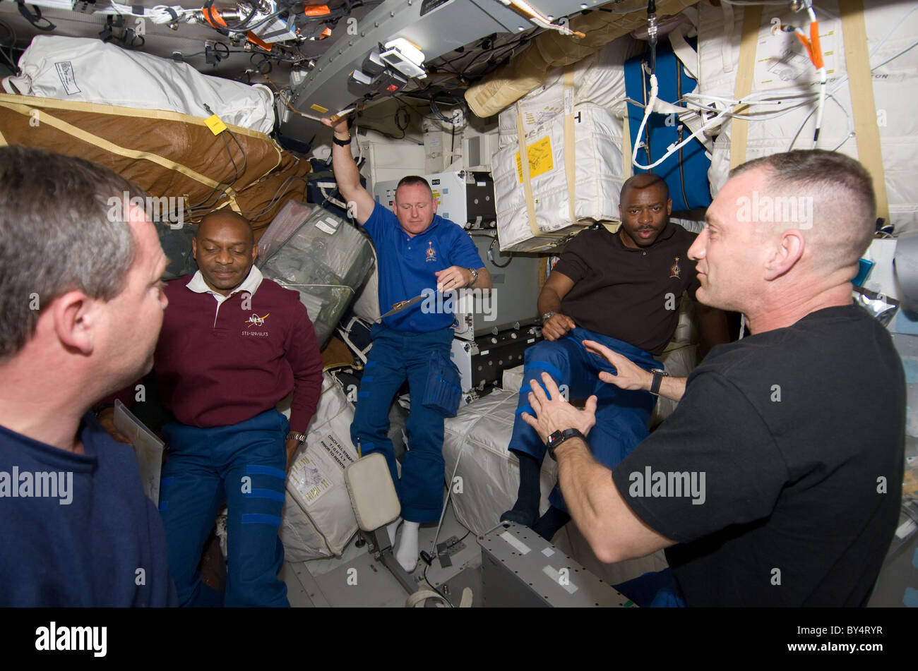 STS 129 Astronauts being briefed by Commander Charles O Hobaugh in Space Shuttle Atlantis Stock Photo