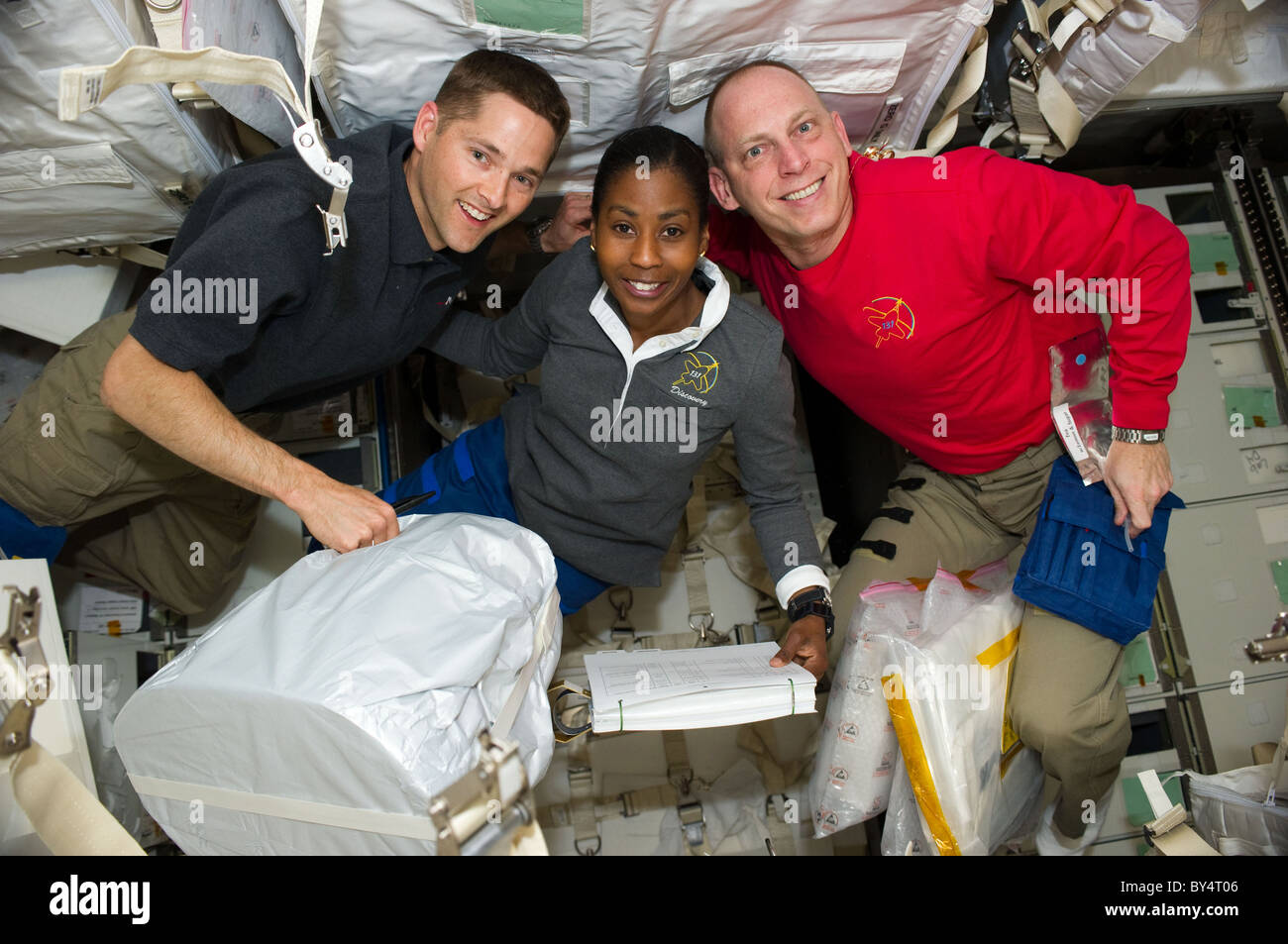 STS 131 Astronauts James P. Dutton, Jr, Stephanie Wilson & Clayton Anderson in International Space Station docked with Discovery Stock Photo