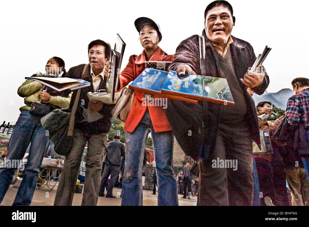 CHINA, YICHANG, SANDOUPING:  Vendors aggressively selling souvenirs and books about the Three Gorges Dam Stock Photo
