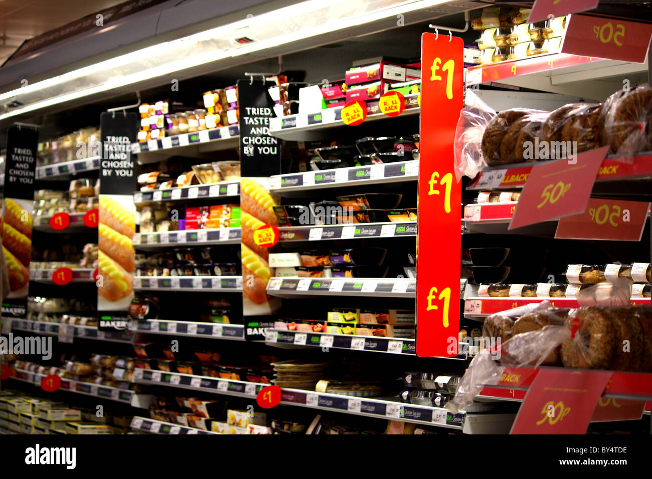 Food bargains at Asda's supermarket; showing fridge food products at competitive prices after the VAT rise in 2011 Stock Photo