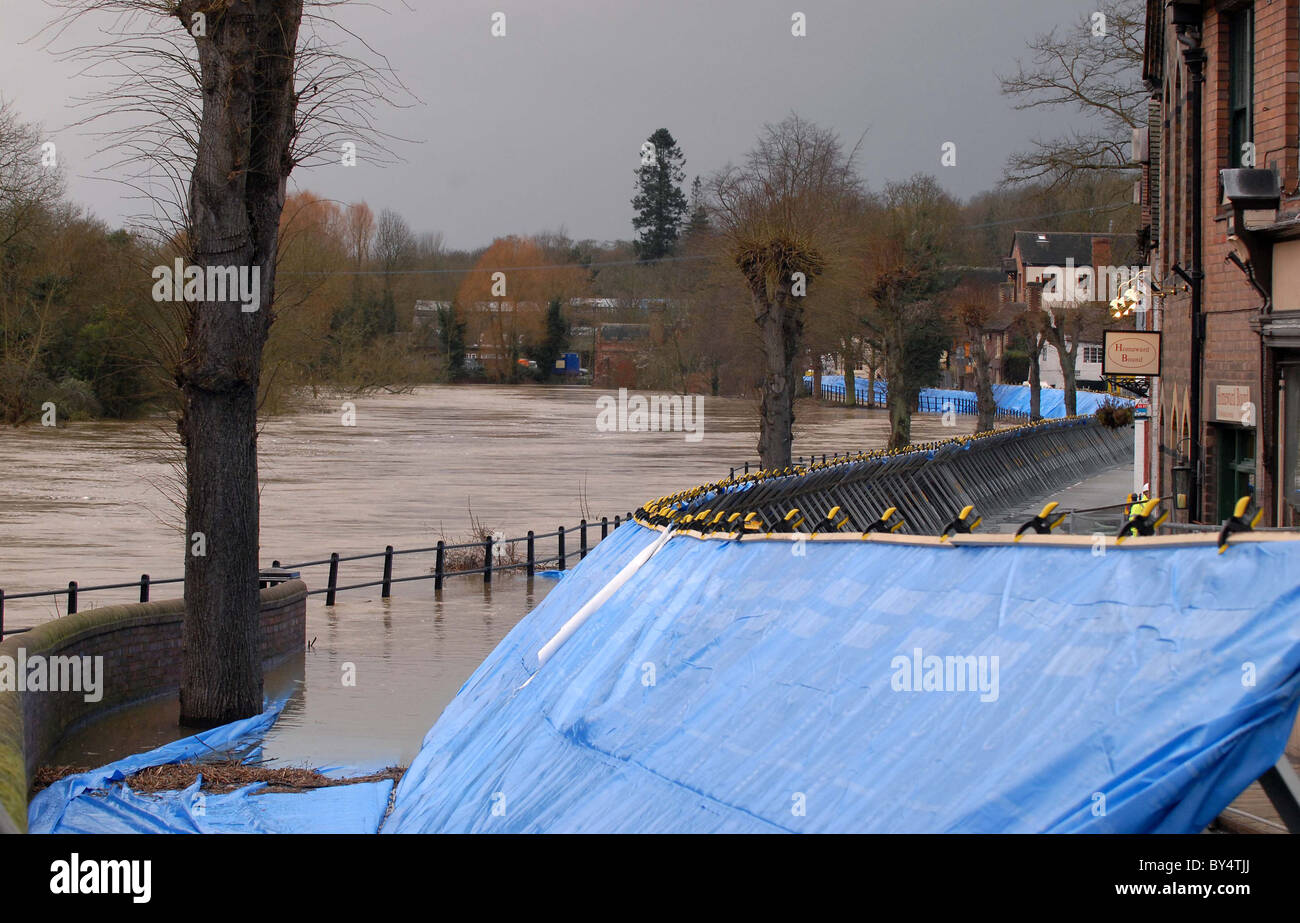 Flood defence barriers hold back flood water in Ironbridge, Shropshire as the River Severn broke its banks. Stock Photo