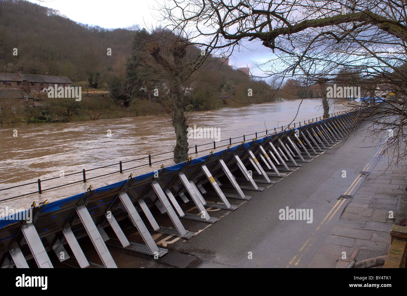 Flood defence barriers hold back flood water in Ironbridge, Shropshire as the River Severn broke its banks. Stock Photo