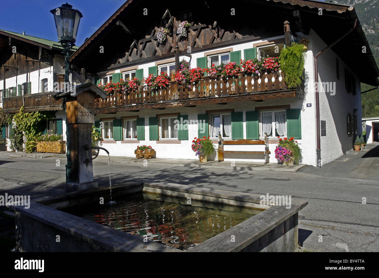 Germany Bavaria Garmisch-Partenkirchen Fruhling Strasse decorated bavarian buildings with balconies and flowers architecture Stock Photo