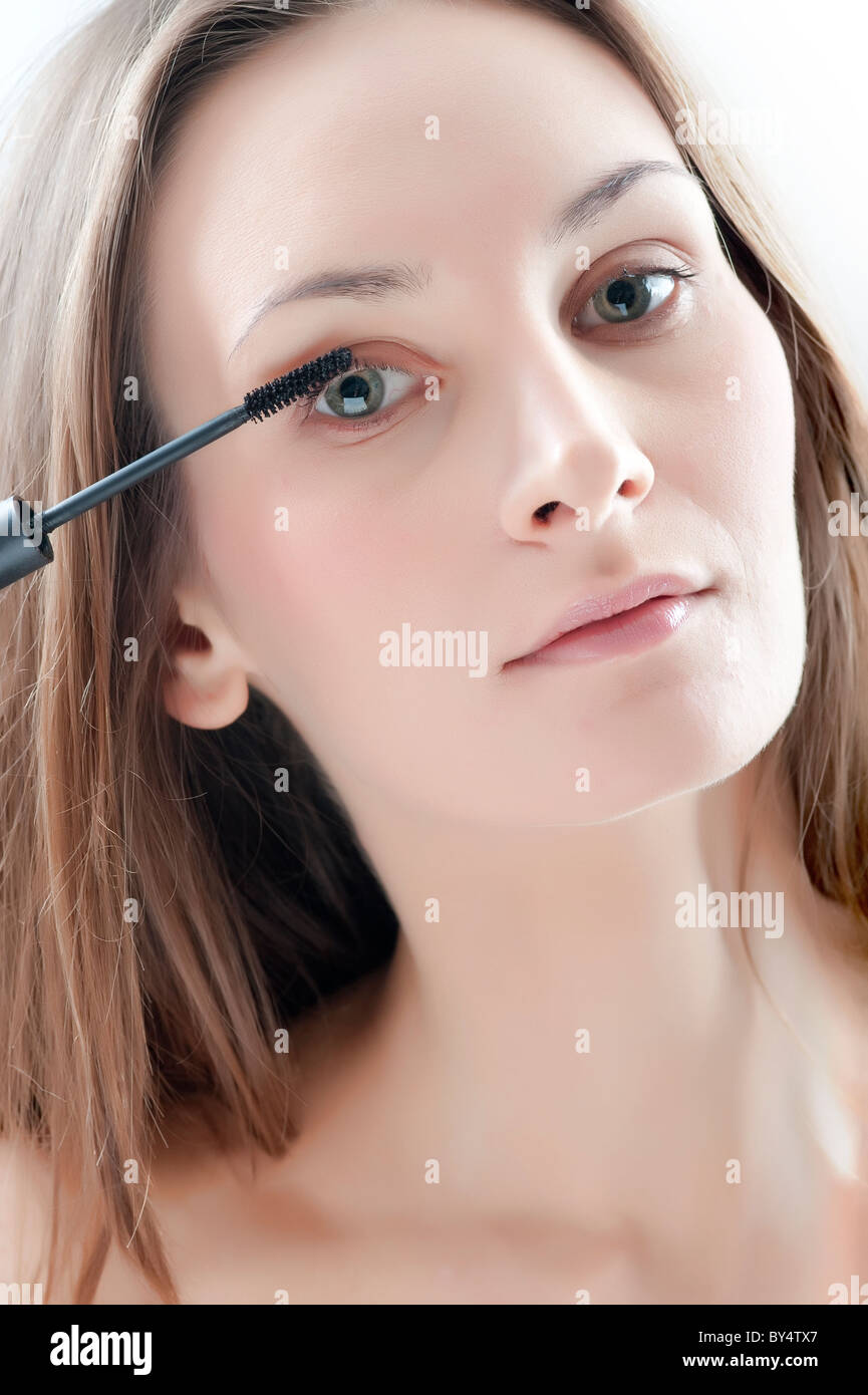 woman applying mascara Stock Photo