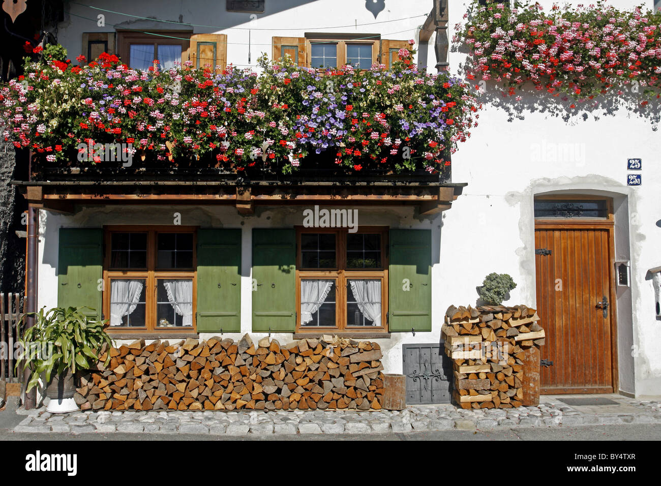 Germany Bavaria Garmisch-Partenkirchen Fruhling Strasse decorated bavarian buildings with balconies and flowers architecture Stock Photo