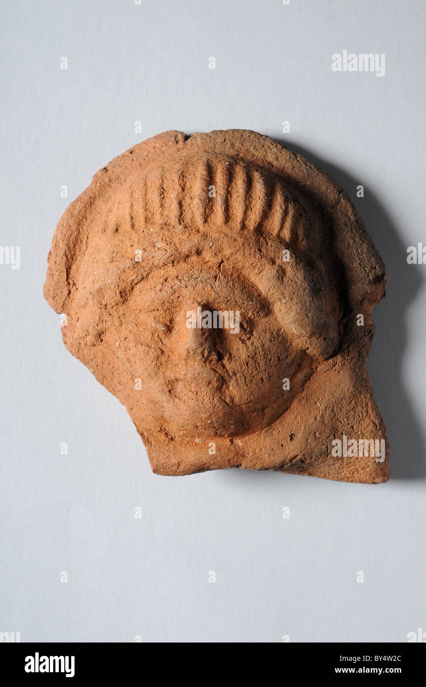 Antefixes of terracotta representing female head  (1 st - 3rd CE )  Roman era Complutum  ALCALA DE HENARES Madrid  SPAIN Stock Photo