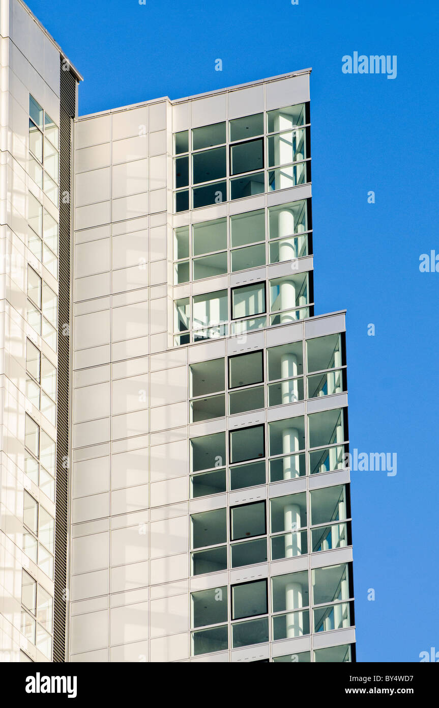 Windows of an empty tall office and apartment block Stock Photo