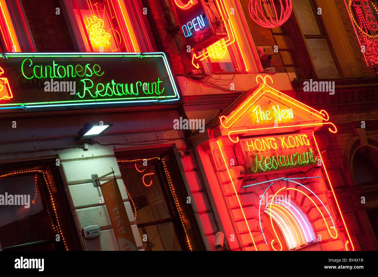 Illuminated restaurant signs, China Town.Manchester city centre. Stock Photo
