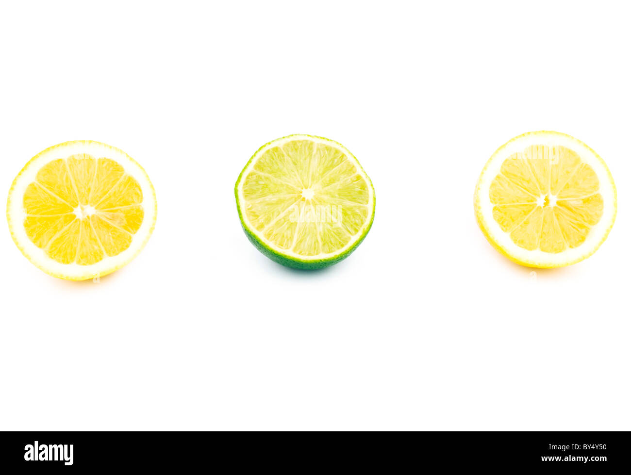 Lemon and lime halves on white background Stock Photo