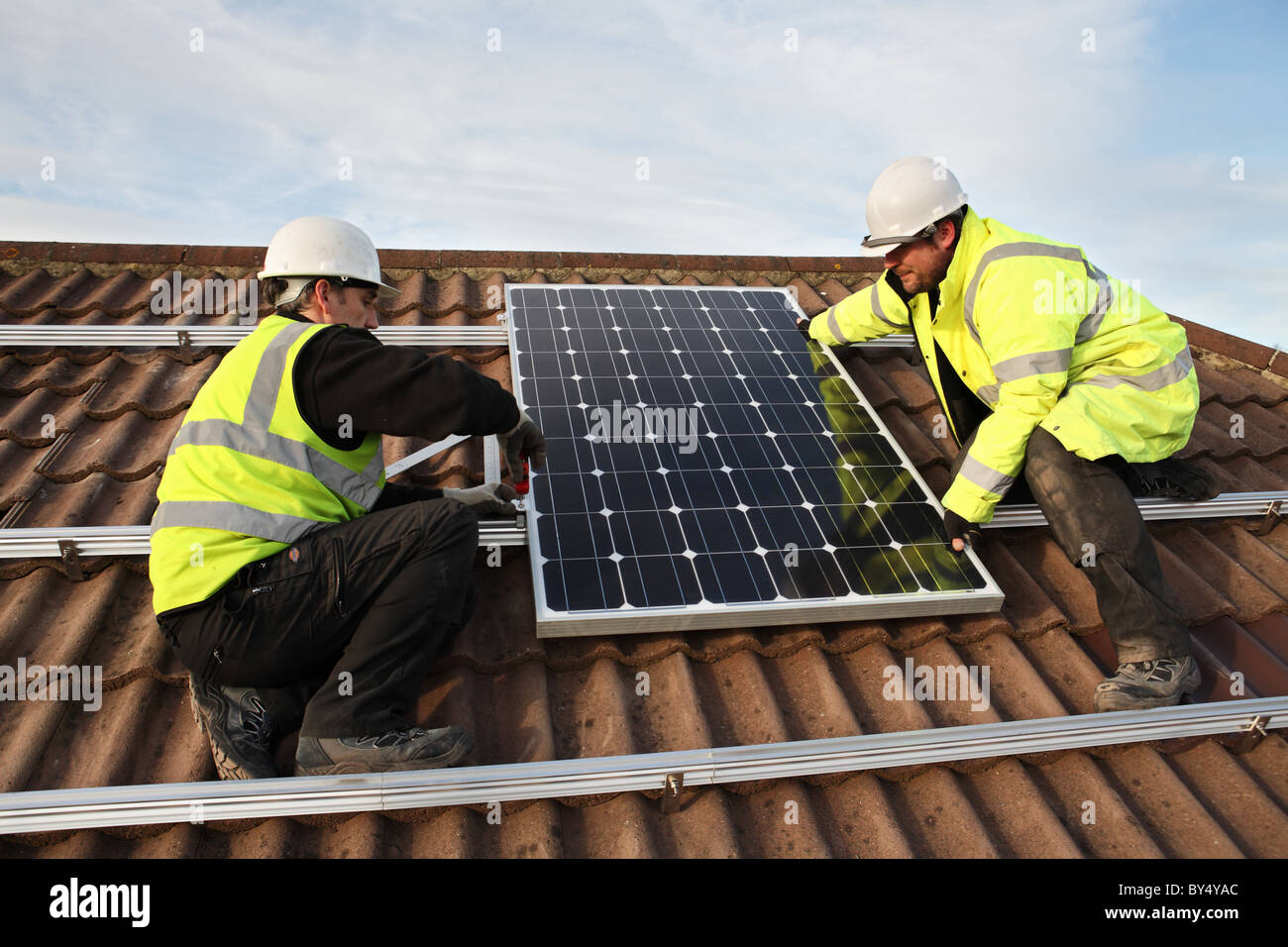 Installing photo voltaic solar panels onto the roof of a domestic house