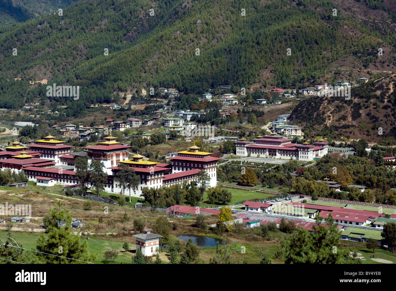 Government in Thimpu, Bhutan's capital, is in the great gold-capped dzong, or fortress, left., with Parliament facing it, right Stock Photo
