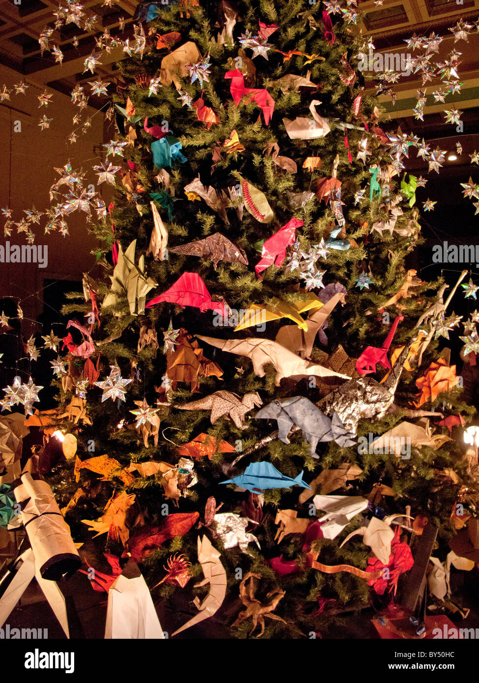 A Christmas Tree Decorated With Folded Paper Origami Images