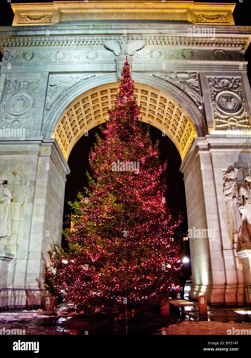 A Christmas tree decorates the famous arch in Washington Square, New York City. Stock Photo