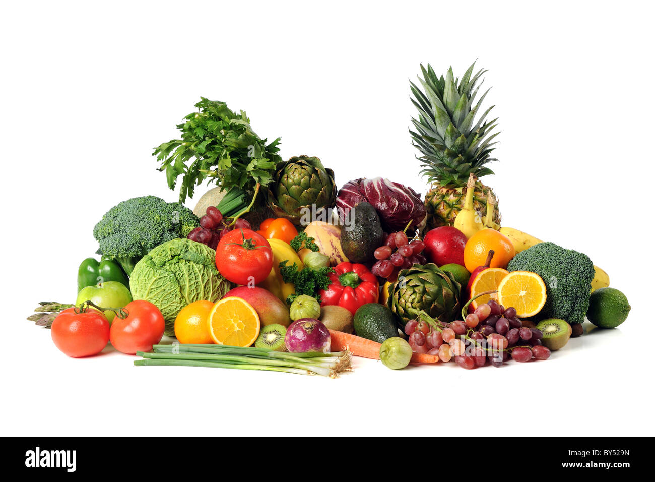 Fresh fruits and vegetables isolated over white background Stock Photo